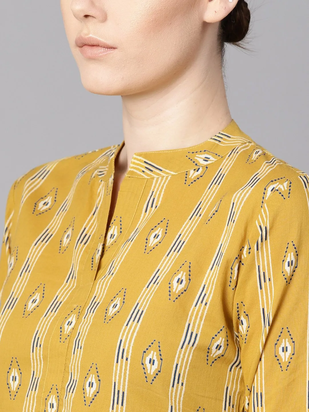 Mustard yellow color ikat printed chinese collar dress with placket opening.
